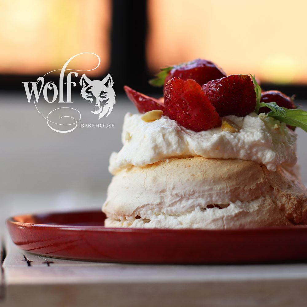 Strawberry pavlova at sunset by Milene Pereira at Wolf Bakehouse